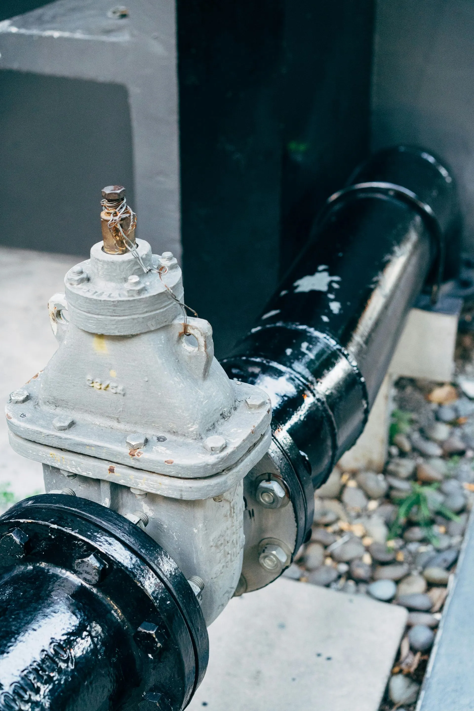 Main water shutoff valve on a black cast-iron water line